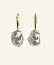 Load image into Gallery viewer, Suspended from an elongated vertical gold bar hangs an unruly pearl. Lustrous and perfectly imperfect, the unique distinctiveness of baroque pearls is a beautiful reminder that we ourselves are just that.   Named after the Queen Boudicca, who found the warrior within and created her own legend..     Made from juicy natural white baroque pearls   the slim elegant fitting is 18 ct gold plated silver. Each pearl is unique. Handmade. Bassike.