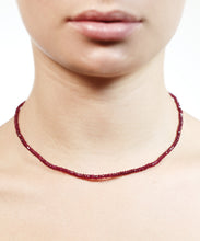 Load image into Gallery viewer, The arresting hue of this ruby necklace is both mesmerising and powerful. The colour of self confidence and fearlessness, rubies vibrate power, nobility and passion. Short and easy to wear this lustrous, elegant and exclusive row of intensity can be worn everyday. Make it your exclusive talisman and reminder of your own sovereignty.