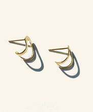 Load image into Gallery viewer, Hand made and fluid in shape, these fine golden earrings wraps around the lobe like a golden harness, exaggerating its curve. Handmade in Australia

