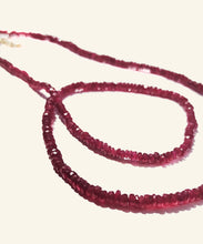 Load image into Gallery viewer, The arresting hue of this ruby necklace is both mesmerising and powerful. The colour of self confidence and fearlessness, rubies vibrate power, nobility and passion. Short and easy to wear this lustrous, elegant and exclusive row of intensity can be worn everyday. Make it your exclusive talisman and reminder of your own sovereignty.
