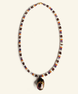 The Artemisia multi gem necklace is threaded with colour and light. Gems such as aventurine, crystal, garnet, amethyst, iolite and smoky quartz make up a string vibrating light and protection. The finishing drop is a peacock baroque pearl. colourful handmade in Australia