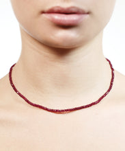 Load image into Gallery viewer, The arresting hue of this ruby necklace is both mesmerising and powerful. The colour of self confidence and fearlessness, rubies vibrate power, nobility and passion. Short and easy to wear this lustrous, elegant and exclusive row of intensity can be worn everyday. Make it your exclusive talisman and reminder of your own sovereignty. 

