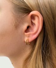 Load image into Gallery viewer, The Gold split earrings gives an illusion of wearing two rings at once. The golden line travels in an elegant curve under the lope and back again. Can be worn down or turned upside down.      18ct gold plated sterling silver. handmade in australia
